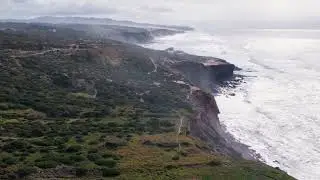 Flying Over Magoito Cliff's and Atlantic Ocean Waves in Sintra, Portugal