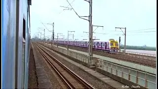 Karnavati Exp. crossing Bombardier Rake  on Vasai Creek.