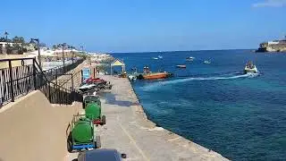 Malta, view of Marina Corinthia beach resort hotel in St Georges Bay, October 2023 Timelapse