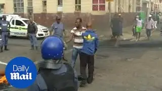 Police fire rubber bullets after wave of anti-foreigner violence - Daily Mail