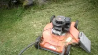 1991 HUSQVARNA push mower mowing a ditch