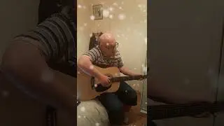 John Mahon Playing his guitar and singing FairyTale of new york