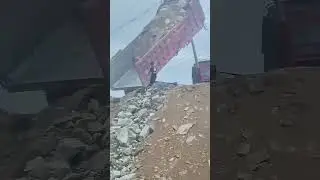 Live Shot: Large Dump Truck Tipping Full Load of Rocks