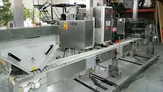 Used horizontal tamper evident/bottle sleeve applicating system  by Axon Corporation.