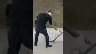 Elon Musk destroying car with a hammer