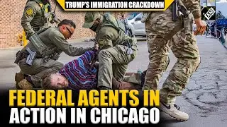 Federal agents detain a man during Trump-ordered immigration raids in Chicago