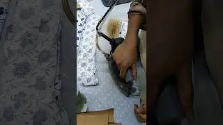 Shirt's collar band inside press iron in garments industry
