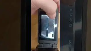 how to insert and clear an SD card in a Canon xa11 camcorder