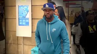 Floyd Mayweather Jr. And Girlfriend Navigate Fan Frenzy At Paris Train Station