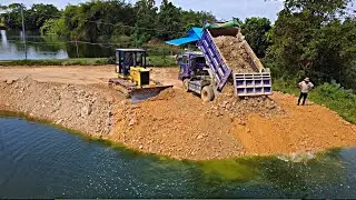 Amazing! Making Landfill into Deep Pond Using D31P Dozer Pushing Stones with Dump Truck Unload