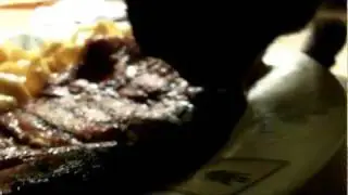 Cat eating a Pork Chop