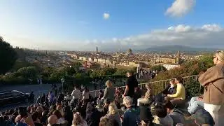 People chilling around Piazzale Michelangelo, looking at the best view of Florence