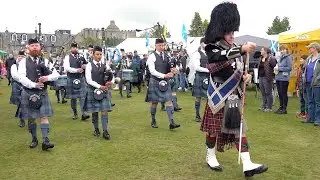 Drum Major Roland Stuart leads Deeside Caledonia Pipe band marching into 2023 Aboyne Highland Games