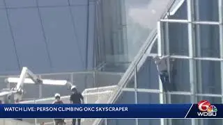 Person climbing OKC skyscraper