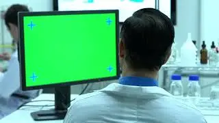 scientist with green screen 4K footage with tracking markers