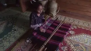 Katu weaving with beading on a backstrap loom in Laos