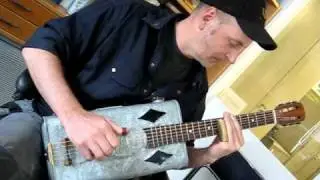 TinCanPete playing on his tin can guitar