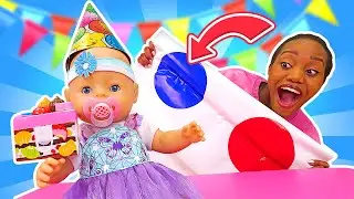Baby Emily doll plays Twister. Family fun with baby dolls and toys for girls. Party for baby dolls.