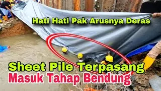 pasang sheet pile baja selesai, kini masuk tahap pengurugan bendung sisi kalimalang yang jebol