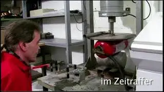 Minimax-Feuerlöscher - Quetschversuch und Berstprüfung