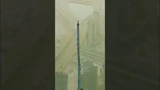 Sam Sunderland standing on top of  the Burj Khalifa, Dubai