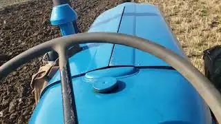 fordson roadless power major pulling two different types of plough