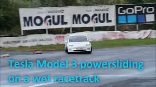 Tesla Model 3 with Track Mode power sliding on wet Sosnov&aacute; (CZ) racetrack