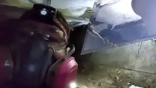 Handyman Stan fixes a crack in a foundation under a house
