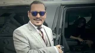 Johnny Depp leaving court today listening to Phil Collins