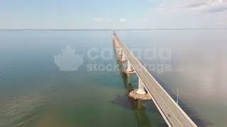 Orbiting drone aerial of Confederation Bridge linking New Brunswick and PEI stock video. Summer. 4K