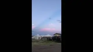 Country Jam, 6-15-19, unusual streak in sky and two moons.