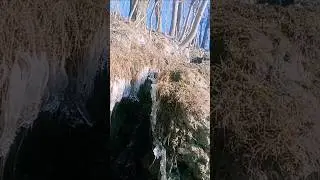 A photo of freezing water at the stream banks # photography # vediography # shorts