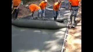 Curb Roller's Hydra-Screed on Large Flume Gutter
