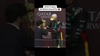 Lando lifts the British Grand Prix trophy 🏆