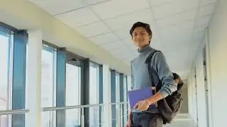 indian student with a books in the university  | Free Stock Video without Watermark or Copyright