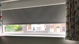Motorised blackout roller blind in a cassette for total darkness.