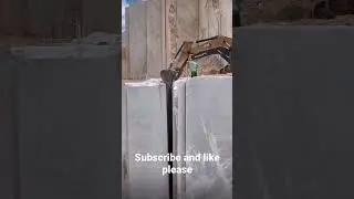 Dropping exotic rock with excavator
