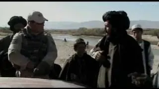 Afghan people and Dutch soldiers at Uruzgan checkpoint