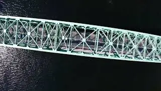 aerial drone footage looking straight down on merrimack river flying over tyngsborough bridge
