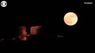 Timelapse shows strawberry supermoon rising over ancient temple in Greece
