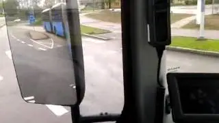 Turning left with a bi-articulated bus seen from the driver's cabin