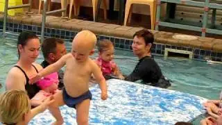 Swimming: walking across the mat (19 mths)