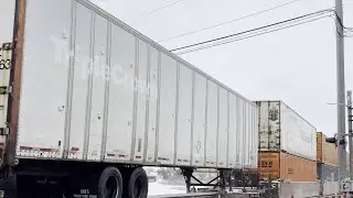 UP7382 East in DeKalb with Ex Triple Crown Trailer