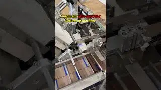 Automatic glue spraying cartoning machine