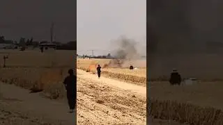 The process of extinguishing a fire in a wheat field using a combine