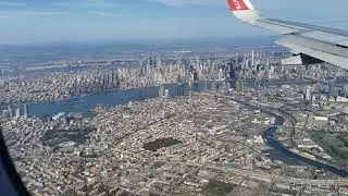 Landing at LaGuardia Airport, view of lower Manhattan and East River