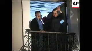 Chavez at palace, thanks supporters, looted shops