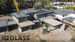 A bespoke glass installation and crane lift on Barnet Lane