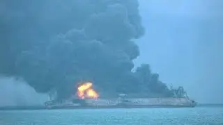 Iranian tanker ablaze and 32 crew missing after collision with freighter off China coast