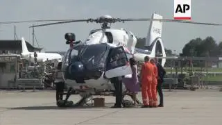 Prince William and Kate take their children Prince George and Princess Charlotte to look at two heli